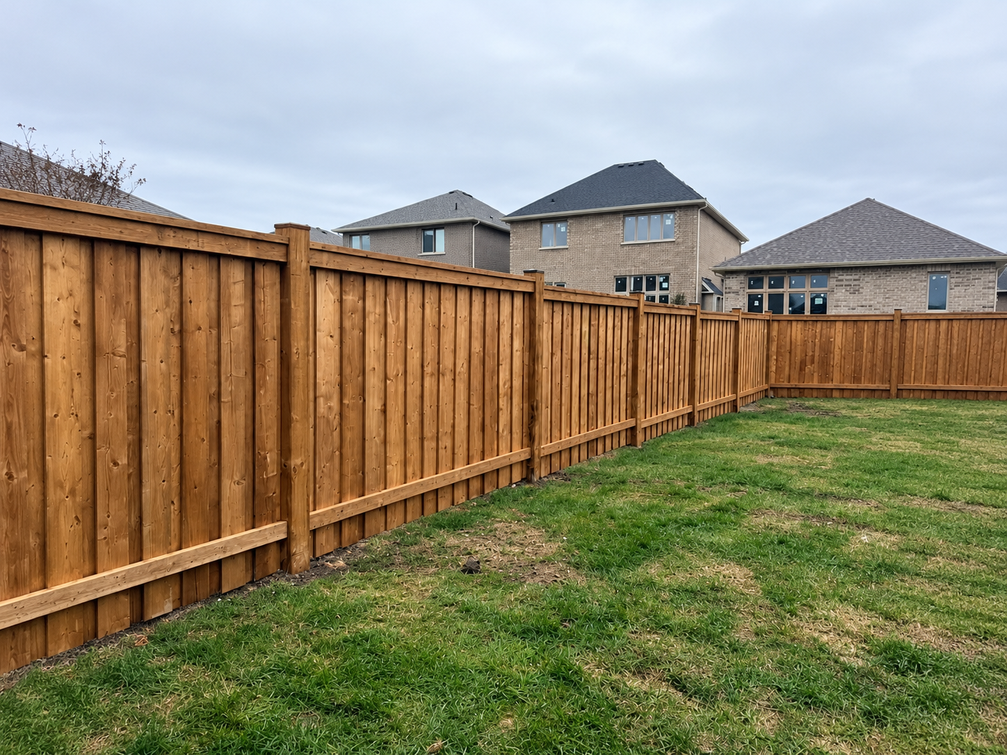 Tall cedar privacy fence around a backyard